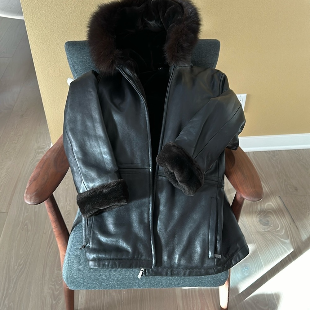 Plush lined leather jacket with fur trim hood